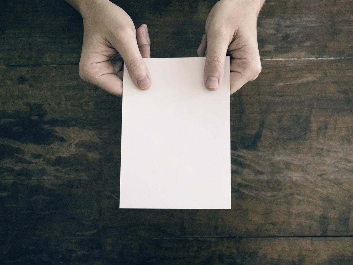 A hand offering a single printed page — every request leaves a receipt